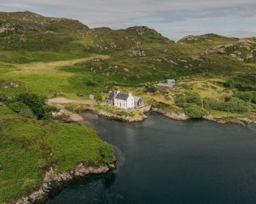 At Fanagmore in Sutherland, a former school and schoolhouse stood in a remarkable setting at the end of a winding road, overlooking a sea loch. Time, neglect and a succession of unsympathetic additions had left both buildings in a dilapidated condition, yet their inherent character and extraordinary location remained undiminished.
Sketched in a roadside lay-by on the journey home from the first site visit, the architectural response arrived almost immediately
The proposal links the two existing buildings with a new parallel pitched-roof structure containing a glazed entrance, utility, study and open-plan living space. A carefully framed axial view extends from the former classroom, now a kitchen and dining room, through the new extension to the loch beyond. The restored schoolhouse accommodates three bedrooms and two shower rooms, while the new addition sits quietly between and behind the original buildings, almost as though it has always occupied their shadow.
The result is an economical and understated solution that celebrates the existing architecture, carefully restoring its character while allowing it to begin a new chapter as a family home.
Completed in 2019, the project was revisited this summer by photographer Richard Gaston @richardgaston , whose new photographs capture the house as it has settled naturally into its landscape, framed by a garden that has been thoughtfully cultivated and lovingly maintained by its owners.
#architecture #scottisharchitecture #restoration #exstention #oldschoolhouse