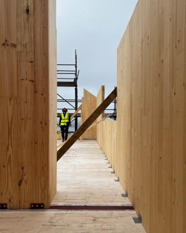 The houses are taking shape in Tongue.
The first CLT structures, manufactured off-site by Egoin, are now being craned into position, marking an important stage in the construction.
The larch structure will remain exposed internally, wrapped in woodfibre insulation and larch cladding, carrying timber through from structure to finished surface.
Above stone-built ground floors set into the hillside, the lighter timber upper levels open towards expansive views across the Kyle of Tongue.
The gardens will extend the surrounding moorland around the buildings, helping them bed into the wider landscape.
#scottisharchitecture #ruralarchitecture #ruralhousing #highlandarchitecture #sutherland #tongue